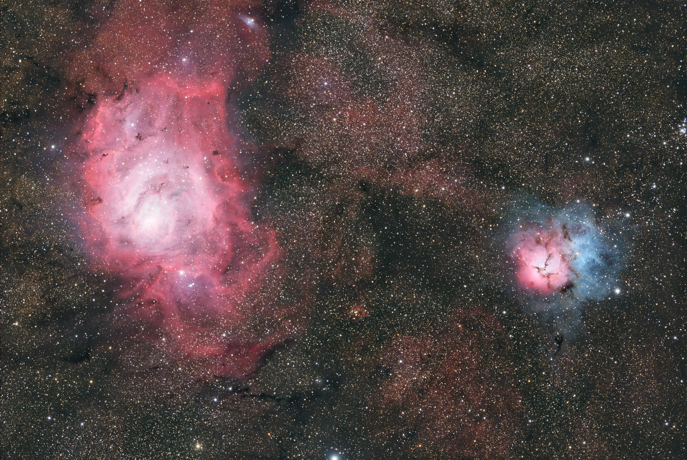 The Lagoon Nebula, a bright emission nebula threaded by a dark dust lane.
